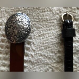 2 Skinny Belts! Brown one adjusts from 30” to 34”, the black one 33” to 34”